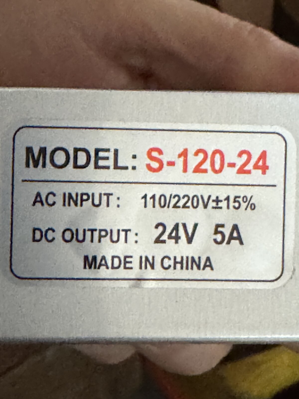 Rating label on the AC to 24V 5A power supply, model S-120-24, 110 to 220V AC input and 24V 5A DC output